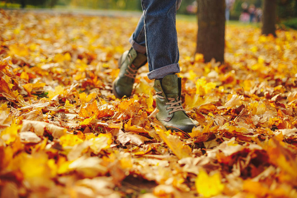Leather shoes walking on fall leaves Outdoor with Autumn season nature on background Lifestyle Fashion trendy style - Foto, afbeelding
