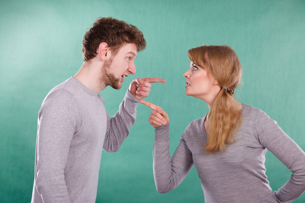 Bad relationship and divorce. Expressive young couple yelling shouting. Husband and wife having big emotional argue split quarrel. - Foto, immagini