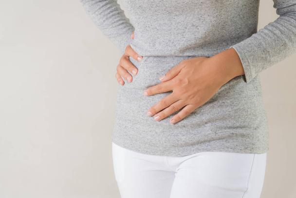 Young woman having painful stomachache. Chronic gastritis. Abdomen bloating concept. - Φωτογραφία, εικόνα