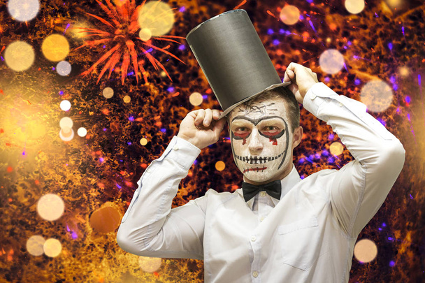 Halloween concept. Halloween party background. Man with costumes and makeup on a celebration of Halloween. Skeleton face of festive halloween day. - Zdjęcie, obraz
