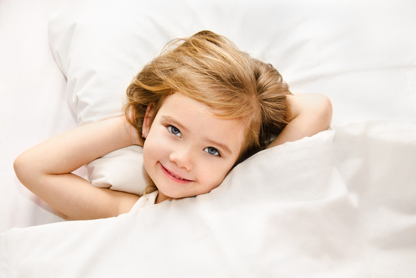 Adorable little girl awaked up - Фото, изображение