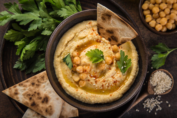 chickpeas hummus with olive oil and smoked paprika, top view - Fotografie, Obrázek