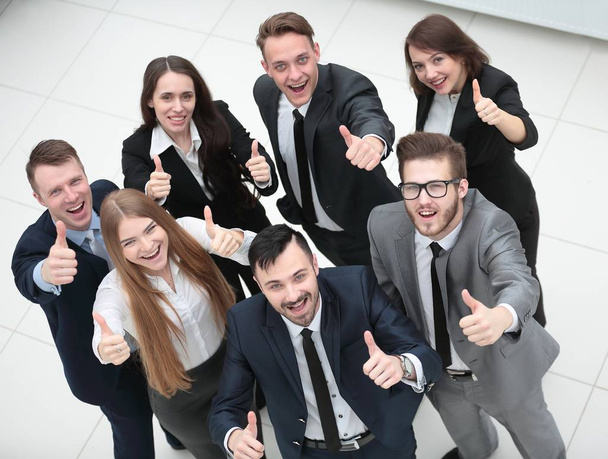successful business team holding up a thumbs up - Foto, afbeelding
