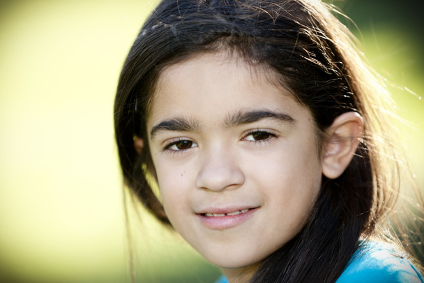 Close up headshot image of smiling hispanic little girl - Фото, изображение