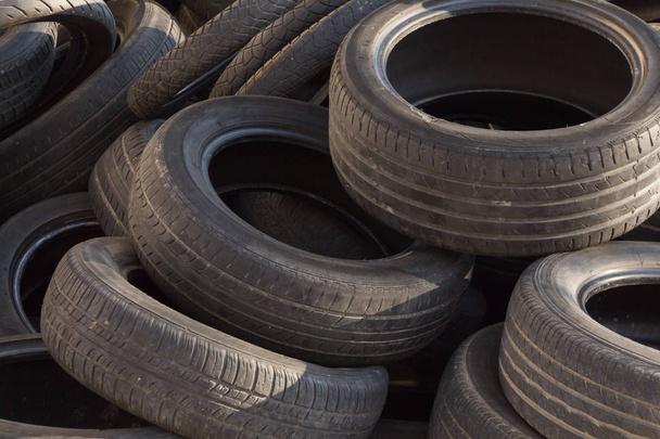 Pile of old used tires, closeup background. - Photo, Image