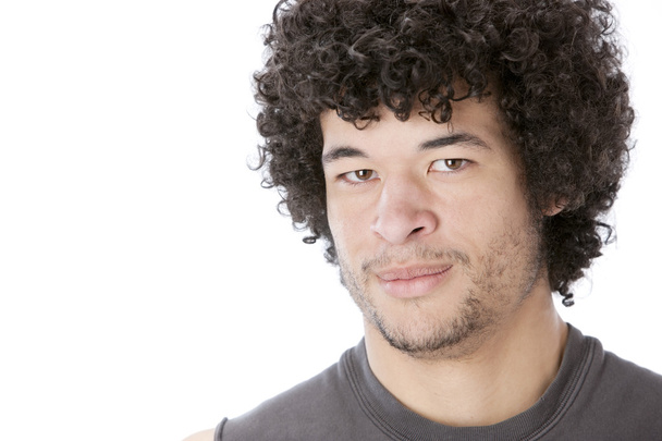 Headshot of serious mixed race young man - 写真・画像