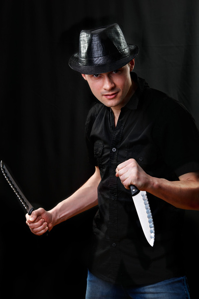 Portrait of man holding two kitchen knife - Фото, зображення