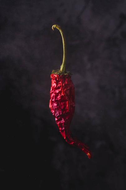 Dried, red, hot pepper on black background with copy space. - Valokuva, kuva