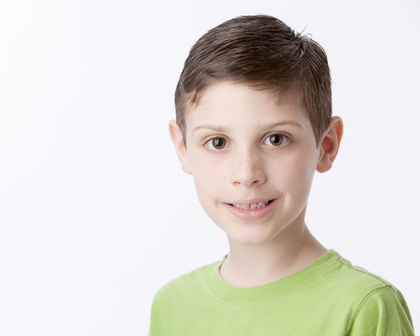 Real. Caucasian smiling little boy with brown hair and brown eyes - Fotografie, Obrázek
