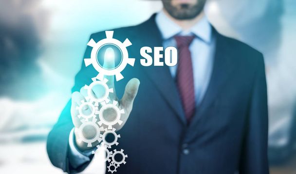 Business man touching  SEO  text on screen - Photo, image