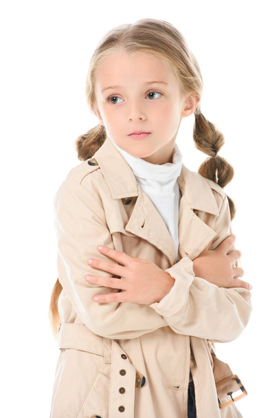 adorable kid posing in trendy beige coat, isolated on white - Фото, изображение