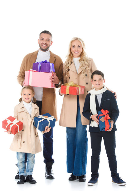 stylish parents and adorable kids holding presents, isolated on white  - Φωτογραφία, εικόνα