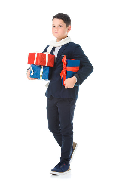 adorable preteen boy holding presents, isolated on white - Φωτογραφία, εικόνα