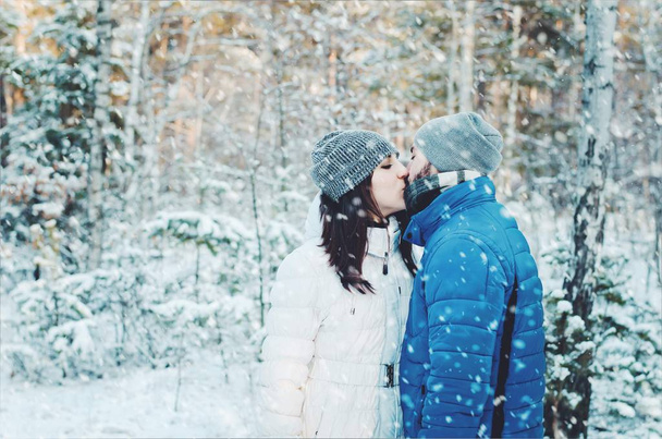happy couple in love in winter forest - Photo, Image