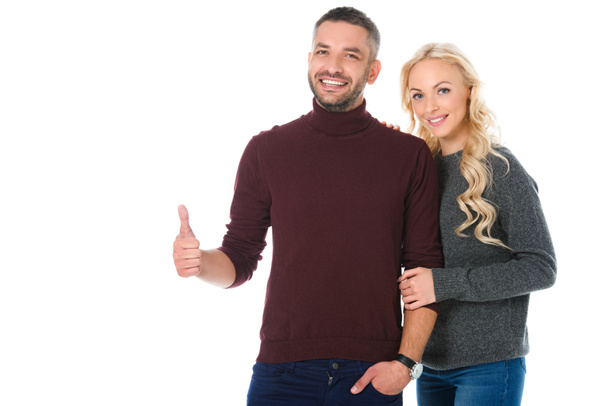 smiling couple posing in autumn outfit showing thumb up, isolated on white - Fotografie, Obrázek
