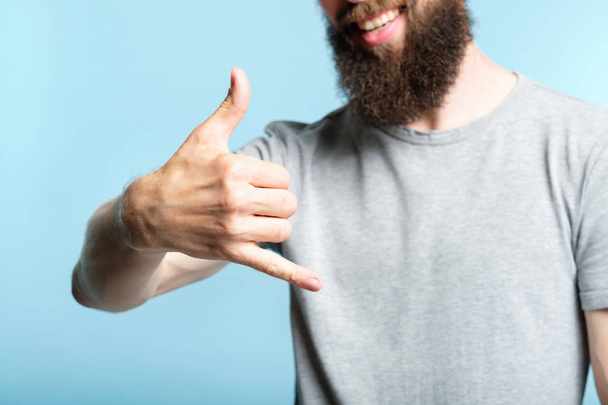bearded man show phone call gesture shaka sign - Φωτογραφία, εικόνα
