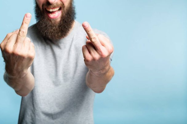 man middle finger defiance offensive attitude - Фото, изображение