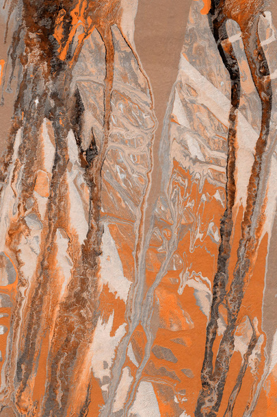 ペイントとオレンジ色の抽象的な背景テクスチャを飛散します。 - 写真・画像