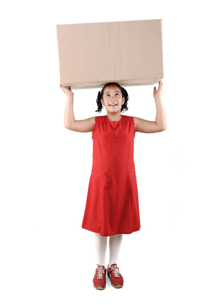 Little girl holding a box, isolated - Фото, изображение