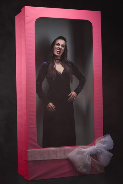 scary vampire woman in pink doll box - Photo, Image