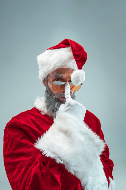 Funny guy in christmas hat. New Year Holiday. Christmas, x-mas, winter, gifts concept. - Valokuva, kuva