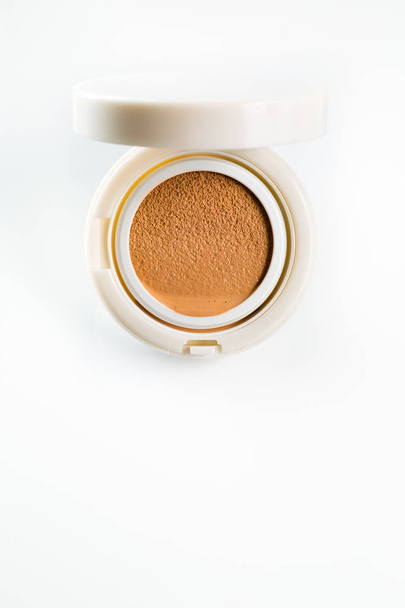 Foundation cushion with a tonal base pouring out of puff - Photo, Image