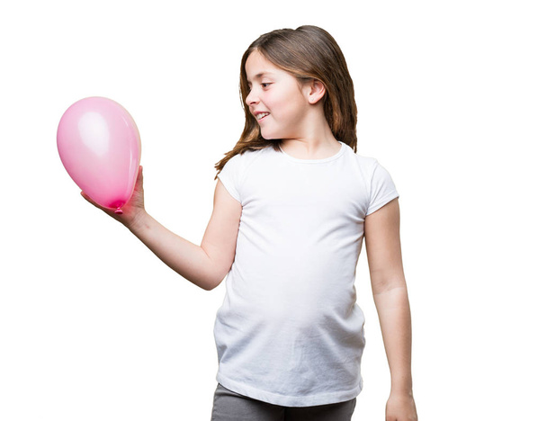 little girl holding a balloon - 写真・画像