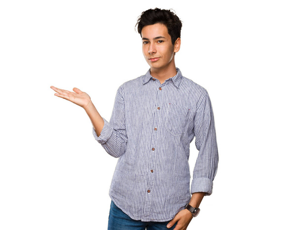 teenager holding something isolated on white background - Photo, Image