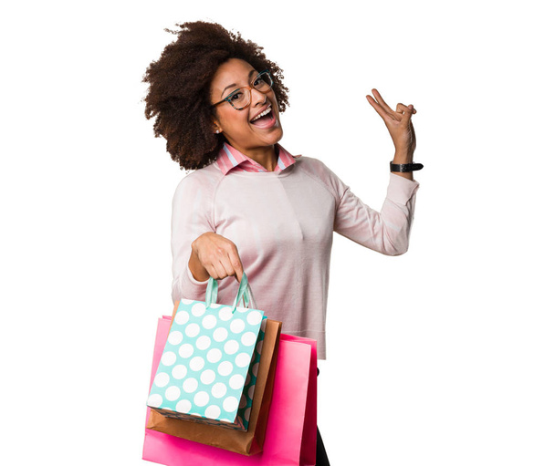 black woman holding shopping bags - Photo, image