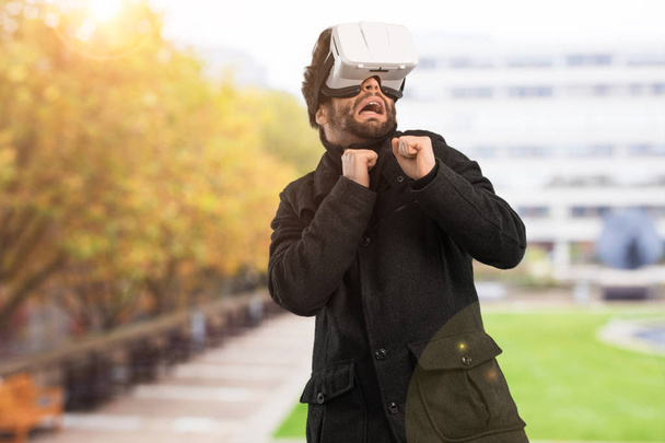 young man using virtual reality glasses - Fotografie, Obrázek