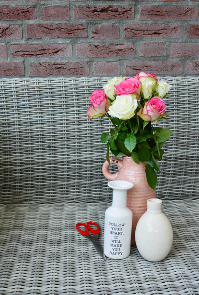pink and white roses in a vase - Photo, Image