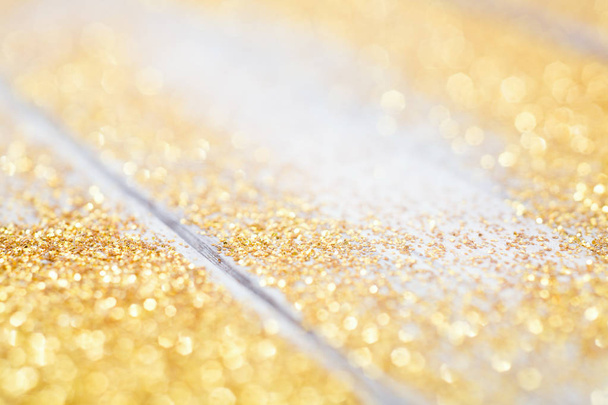 gold shiny powder on wood table  - Photo, Image