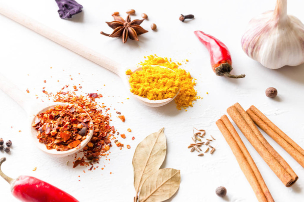 multi-colored spices and herbs on white background close-up - Фото, зображення