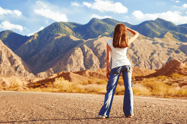 girl standing on the road with her back - Photo, Image