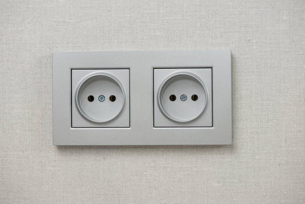 Een stopcontact in de muur. rozet close-up - Foto, afbeelding