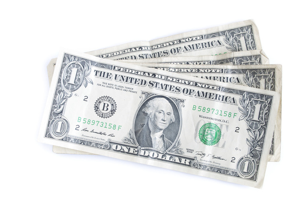 billetes de un dólar doblados a la mitad aislados
 - Foto, imagen