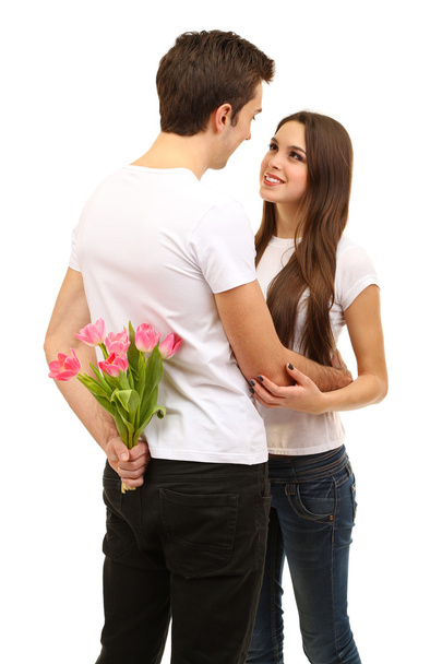 Loving couple with tulips isolated on white - Фото, изображение
