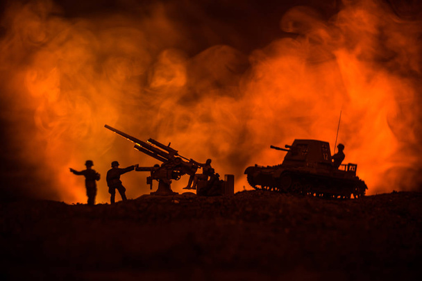 War Concept. Military silhouettes fighting scene on war fog sky background, World War German Tanks Silhouettes Below Cloudy Skyline At night. Attack scene. Armored vehicles. Tanks battle - 写真・画像