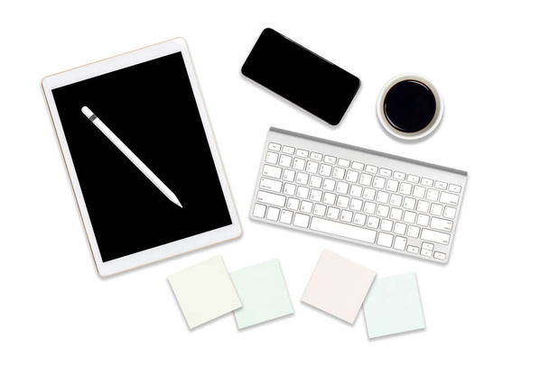 Flat lay photo of office table with laptop computer, digital tablet, mobile phone and accessories. on isolated white background. Desktop office mockup concept. - Photo, Image