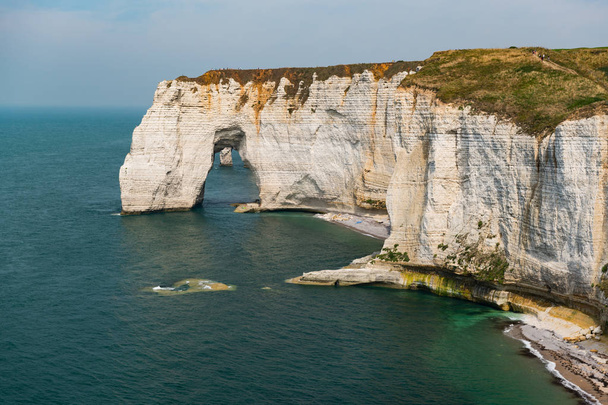 Chalk cliffs of Etretat (Normandy France) with the natural arch called Manneporte - Fotó, kép