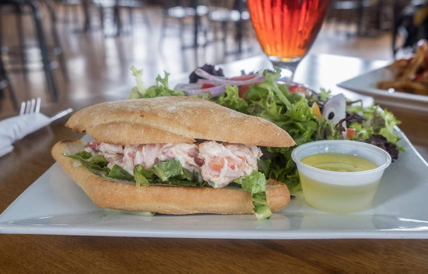 Lobster Roll Served with Fresh Green Salad and Glass of Beer - Photo, Image