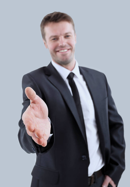 Portrait of happy business man inviting to cooperation isolated  - Photo, image