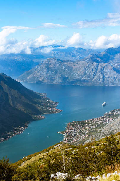View from the mountain on a large cruise ship in the Bay of Kotor - Foto, imagen