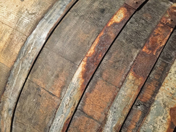 A neutral old oak wine barrel is used to age wine in a Napa Valley winery. - Fotoğraf, Görsel