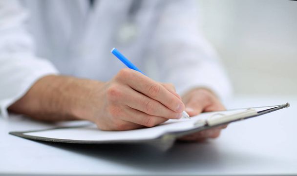 doctor writing out the prescription.close-up - Fotó, kép