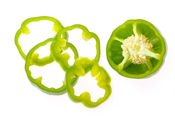 Fresh bell pepper with sliced parts isolated on white background - Foto, Bild