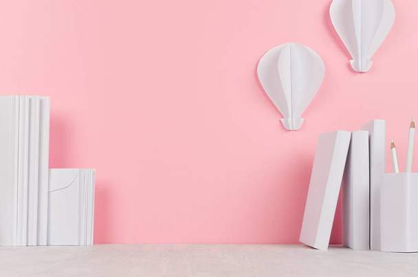 Modern style workplace - white stationery and decorative paper balloons on soft pink background and light desk. - 写真・画像