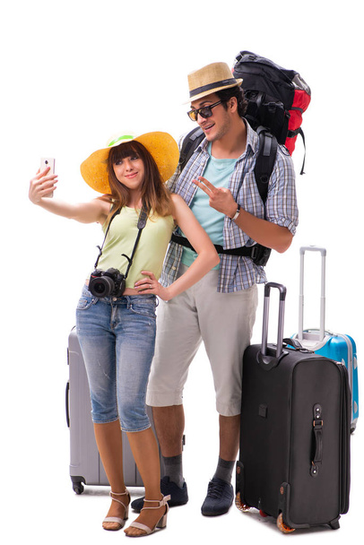 Familia joven preparándose para viajar de vacaciones en blanco - Foto, imagen