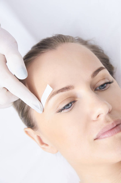 Waxing woman body. Sugar hair removal. laser service epilation. Salon wax beautician procedure. - Foto, afbeelding