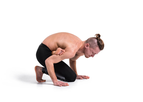 Man practicing yoga on white background. Yoga poses for good health. Sport, meditation and lifestyle concept. Peaceful Meditation for good health.  - 写真・画像